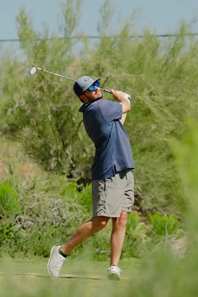 Golfer completing a drive